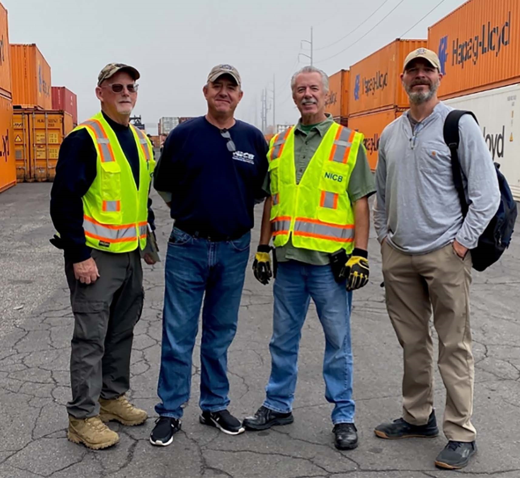 NICB Agents Standing in Cargo Yard