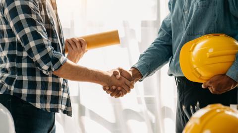 Homeowner and contractor shaking hands