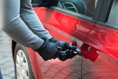 A person breaking in to a car